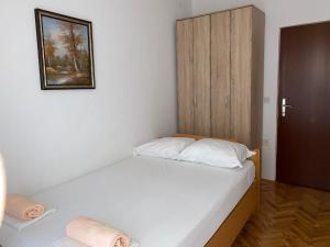 Postel nebo postele na pokoji v ubytování Apartmani Infinity
