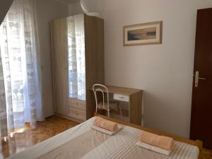 Postel nebo postele na pokoji v ubytování Apartmani Infinity