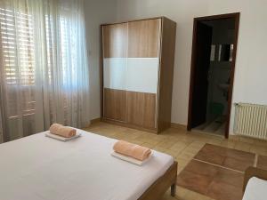 Postel nebo postele na pokoji v ubytování Apartmani Infinity