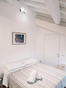 Ένα ή περισσότερα κρεβάτια σε δωμάτιο στο Residenze Mazzini