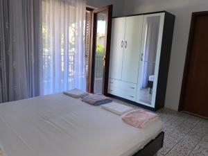 Postel nebo postele na pokoji v ubytování Apartmani Infinity