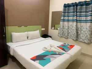 a bedroom with two beds and a window at Homewood Suites ( Service Apartments) in Hyderabad
