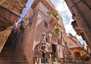 a building with a stairway leading up to a building at Prijeko Palace in Dubrovnik