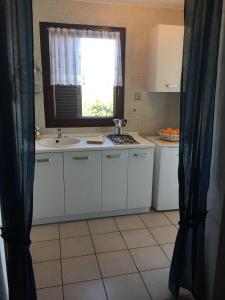 Kuchyň nebo kuchyňský kout v ubytování Apartmani Mirjana Umag