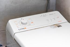 a white washing machine with a control panel on it at Panoramic 2 Bed Penthouse in Los Cristianos