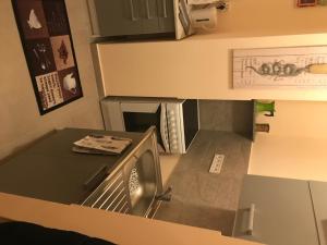 Kuchyňa alebo kuchynka v ubytovaní Menta apartman
