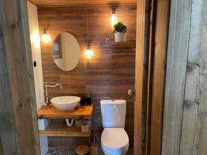 a bathroom with a toilet and a sink at Mountain Eco Shelters in Funchal