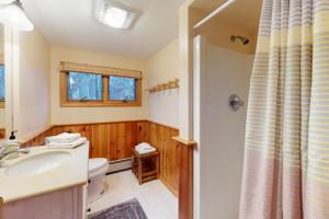 a bathroom with a sink and a toilet at Sunday River Village Timberline in Newry +47 photos