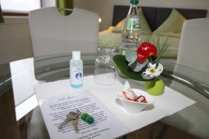 a glass table with keys and a paper on it at FAMOS Schlafen in Warburg