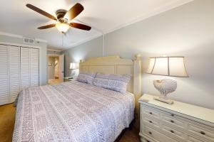 a bedroom with a bed and a ceiling fan at Clearwater II in Gulf Shores