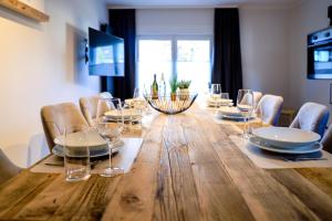 TV a/nebo společenská místnost v ubytování Smart Resorts Haus Topas Ferienwohnung 304