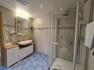 a bathroom with a shower and a sink at Haus Blume in Medebach
