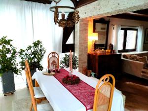 a table with candles on it in a living room at Holiday Home Magnolia in Trakošćan