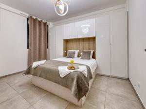 Krevet ili kreveti u jedinici u okviru objekta City Vibes, Indoor Parking, Breakfast & Air Conditioning