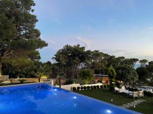 a swimming pool in the yard of a house at Pino Boutique Hotel in Ulcinj