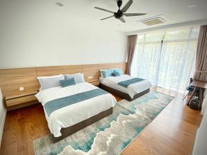 En eller flere senge i et værelse på LeGrace Villa Langkawi Private Pool