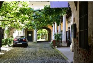 a car parked in front of a building at Brukenthal Studio Sibiu in Sibiu