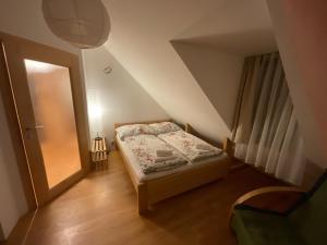 A bed or beds in a room at Tatry Fimali