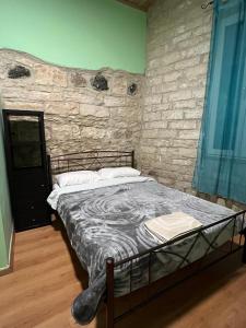 Postel nebo postele na pokoji v ubytování Zouglas App Guesthouse