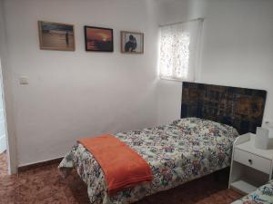 Un pat sau paturi într-o cameră la Casa José