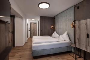 Posteľ alebo postele v izbe v ubytovaní Hotel Das Kohlmais