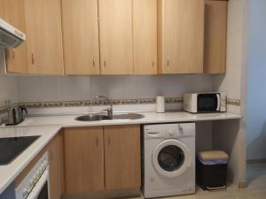 Kuchyňa alebo kuchynka v ubytovaní Apartamento Residencial Puerta Roquetas