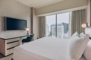 Cama ou camas em um quarto em Vignette Collection SOUMA Hotel by IHG