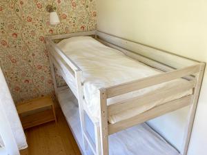 Postel nebo postele na pokoji v ubytování Lilla Halängen cottages