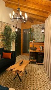 a living room with a couch and a table at Cosy room in Majdal Shams +5 photos