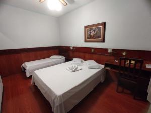 Postel nebo postele na pokoji v ubytování Js Palace Hotel