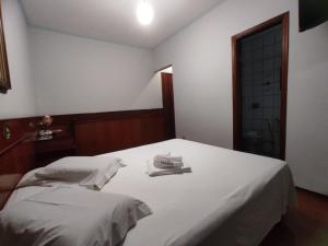 Postel nebo postele na pokoji v ubytování Js Palace Hotel