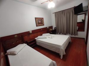 Postel nebo postele na pokoji v ubytování Js Palace Hotel