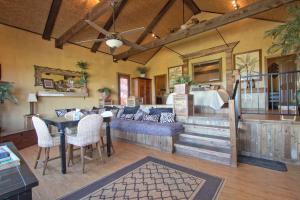 a living room with a couch and a table at Pond House Bungalow @ Bergheim Ranch in Bergheim
