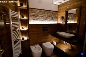 Ванная комната в Bilocale centro paese con posto auto