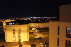a view of a parking lot at night at Veles Apartments in Sibiu