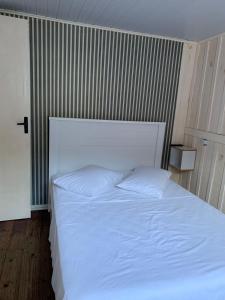 Кровать или кровати в номере Casa Ribeirao da Ilha