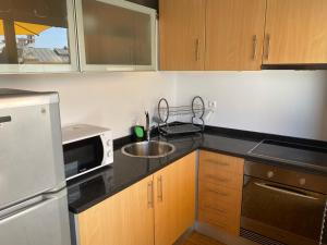 Η κουζίνα ή μικρή κουζίνα στο Apartamento com patio na rua principal da cidade