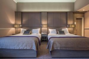 Tempat tidur dalam kamar di Crowne Plaza - Sheffield, an IHG Hotel