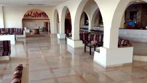 a lobby of a hotel with chairs and a bar at Hotel Best Beach- Family Only in Chott Meriem +47 photos