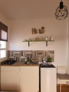 a kitchen with a sink and a counter top at Home Favorito in Tarajalejo