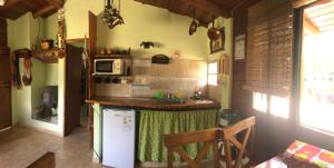 a kitchen with a white refrigerator and a counter at Cabatanti in Tanti