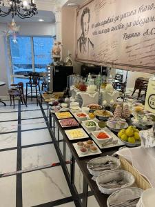 a buffet line with many different types of food at АВРОРА гостиница in Arkhangelsk