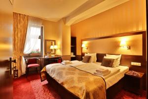 Posteľ alebo postele v izbe v ubytovaní Hotel Wielopole