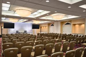 an empty conference room with chairs and lights at Crowne Plaza Englewood by IHG in Englewood