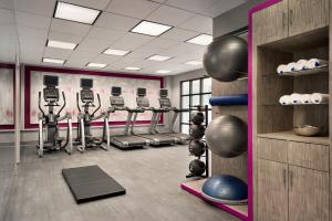 a gym with several treadmills and exercise machines at Crowne Plaza Englewood by IHG in Englewood
