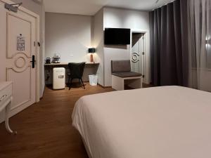 Voodi või voodid majutusasutuse The Kepos Hotel Erlangen toas