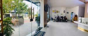 a hallway with motorcycles parked in a building at VISION HOTEL in Phan Rang–Tháp Chàm