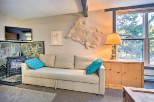 a living room with a couch and a fireplace at Cozy Big Sky Studio about 1 Mile to Mtn Village! in Big Sky
