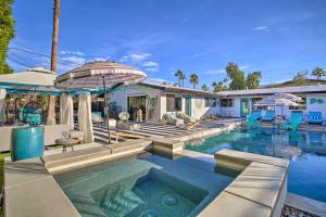 a home with a swimming pool with a house at Vibrant Apt with Saltwater Pool - 3 Mi to Dtwn! in Palm Springs