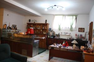 a living room filled with furniture and a room with at VILLA PEPETO Durres Albania in Durrës